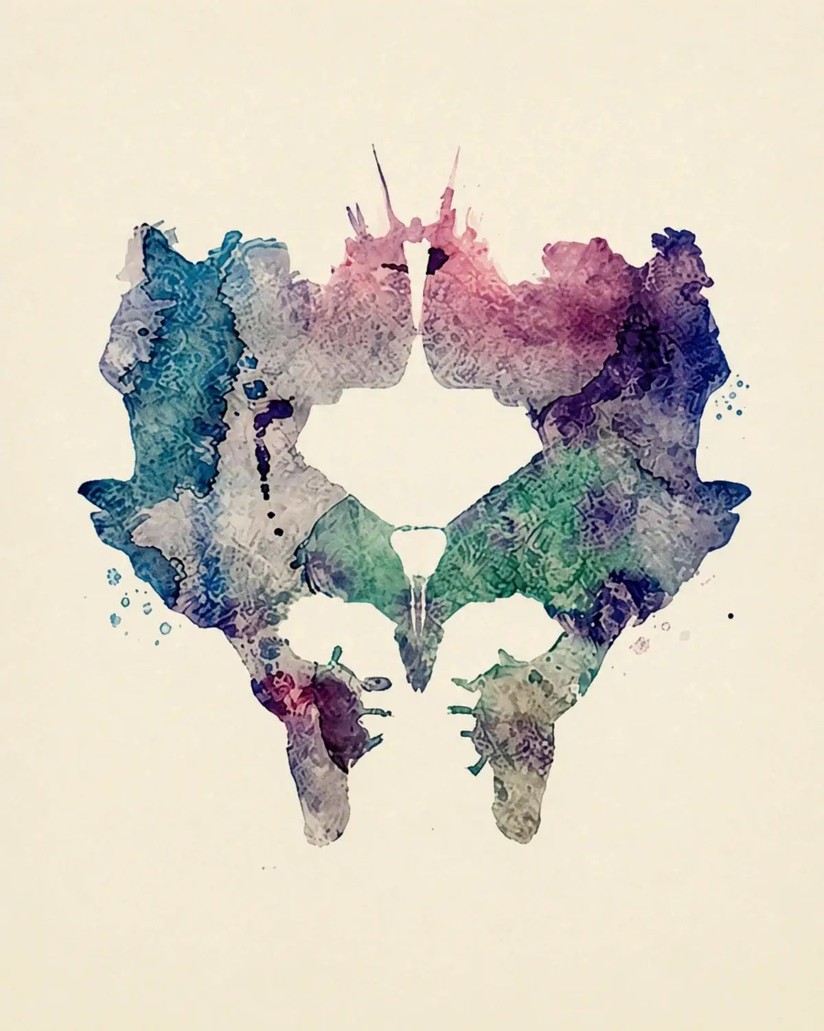 Plate with colourful ink blots on a light background.